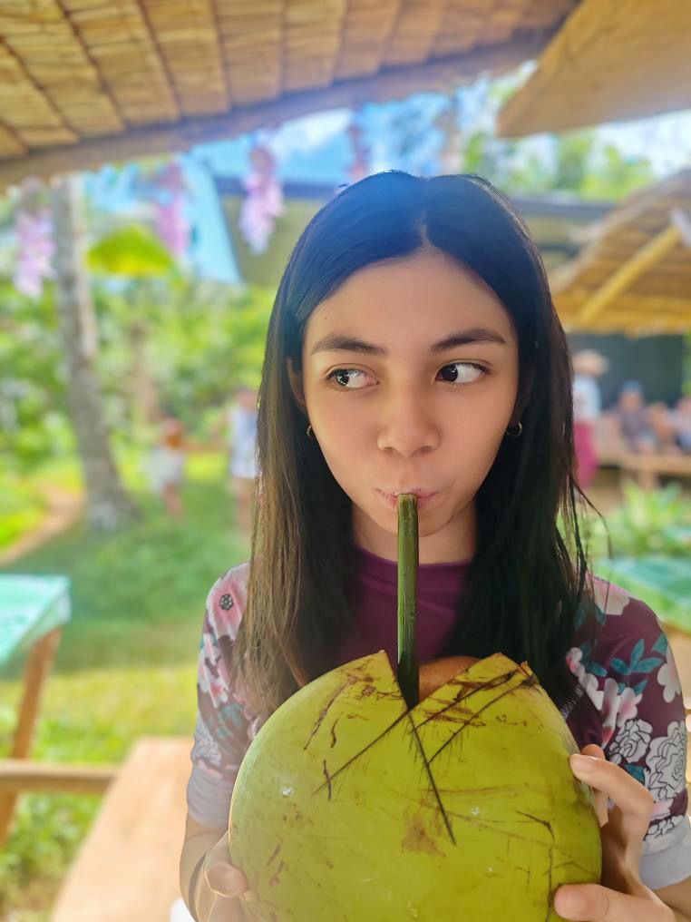 Nyah enjoying fresh buko juice