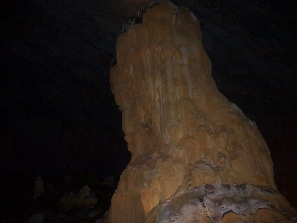 candle-like formation inside underground river