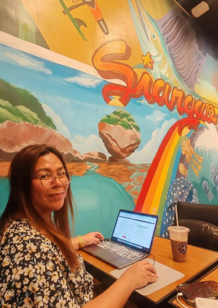 working remotely at tom and toms cafe, Siargao, Philippines