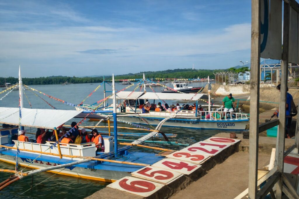 Waiting for our boat assignment before heading to the Underground River.
