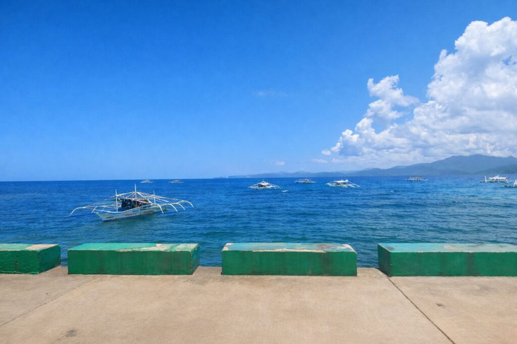 Seaside pier with banca boats